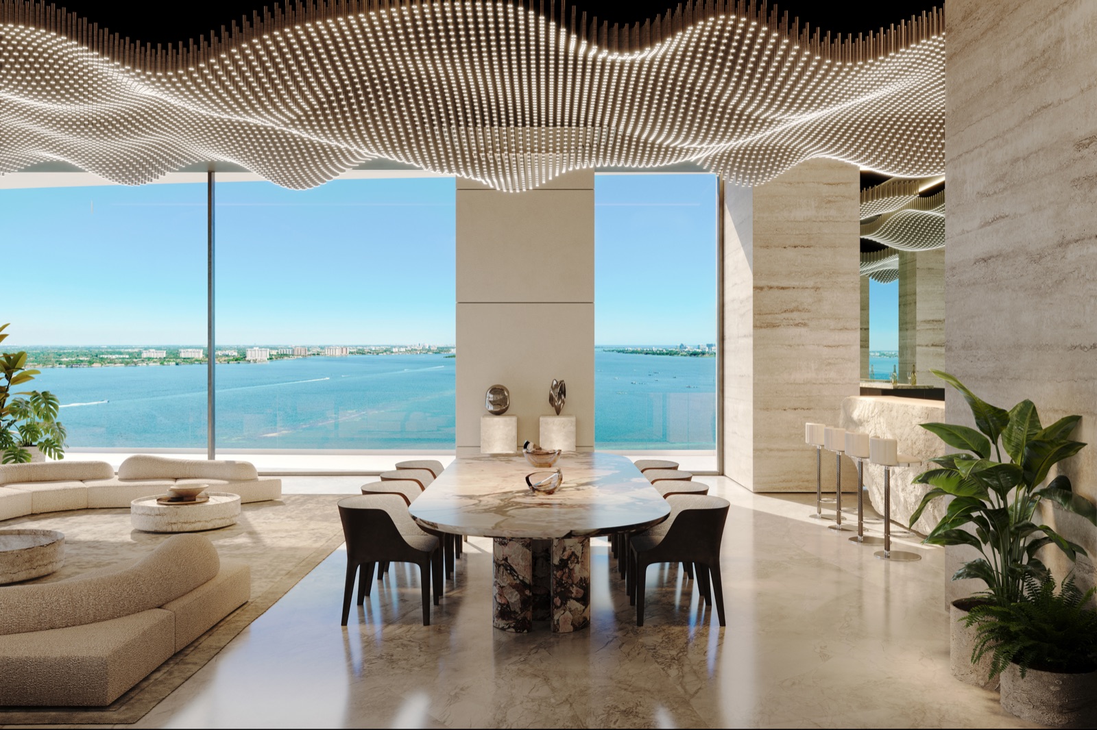Residents' lounge with sculpted seating, hand-finished materials, and Biscayne Bay views.